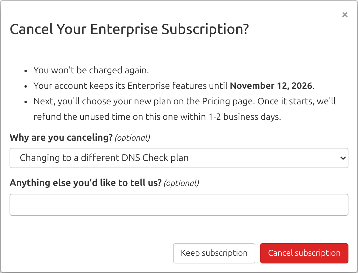 Screenshot of the Cancel Your Enterprise Subscription window with Changing to a different DNS Check plan chosen as the reason, saying the next step is choosing the new plan on the Pricing page